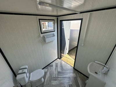 CONTENEDOR SANITARIO CON INODORO Y URINARIO